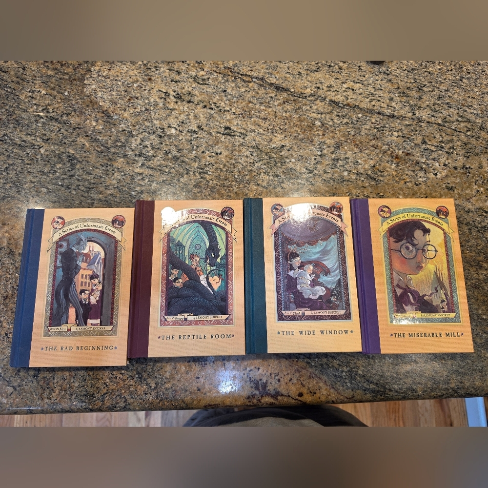 A Series of Four Illustrated Hardcover Books with Colorful Spines-Hardcover